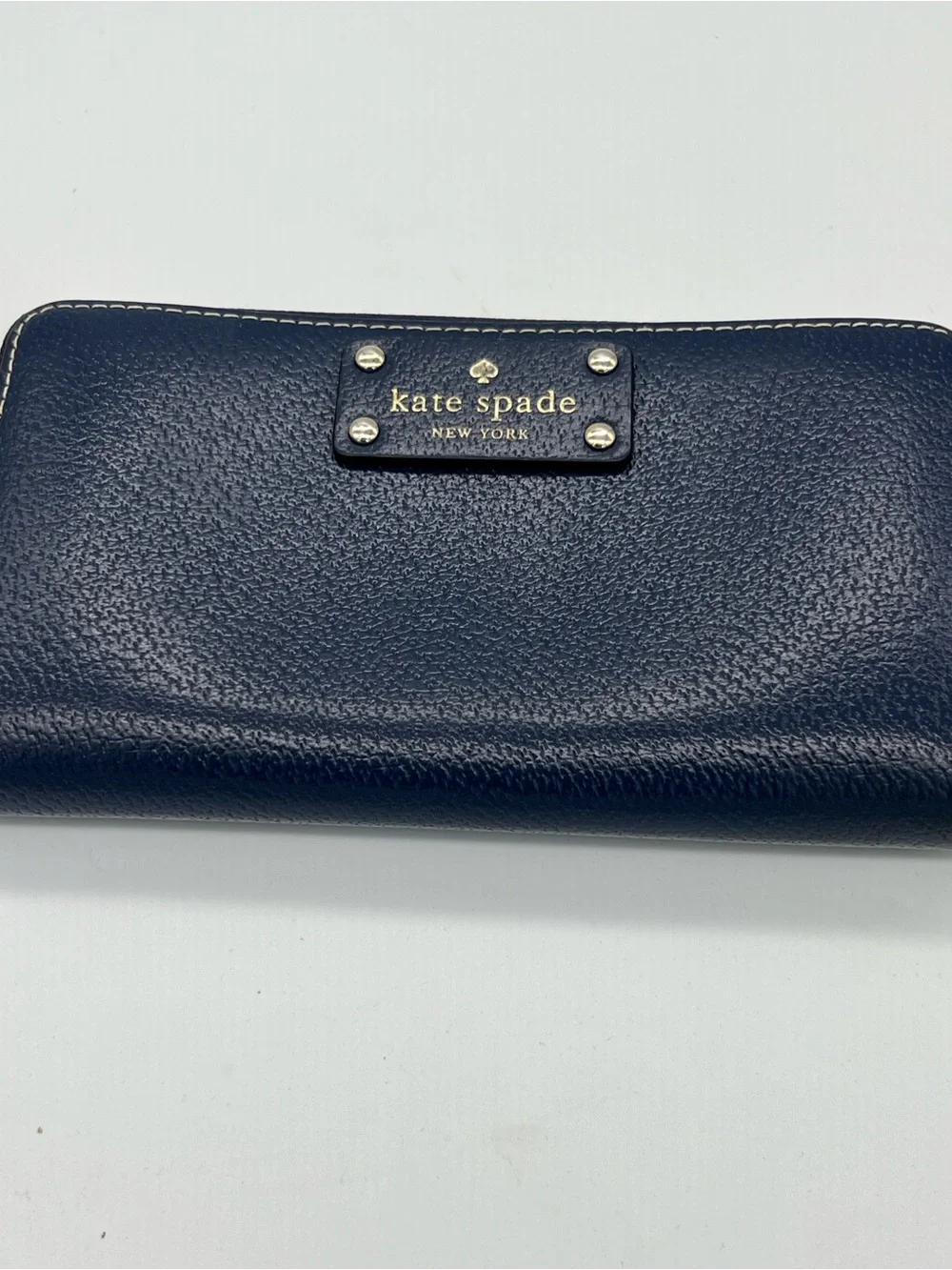 kate spade navy pebbled leather zip wallet with gold plaque